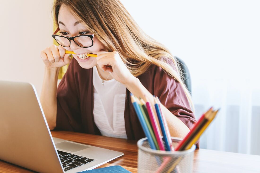 A desperate woman in front of her laptop